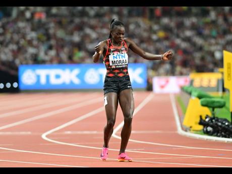 ABOVE: Mary Moraa of Kenya celebrates after her win in the women’s 800-metre final. Moraa clocked  1:56.03.