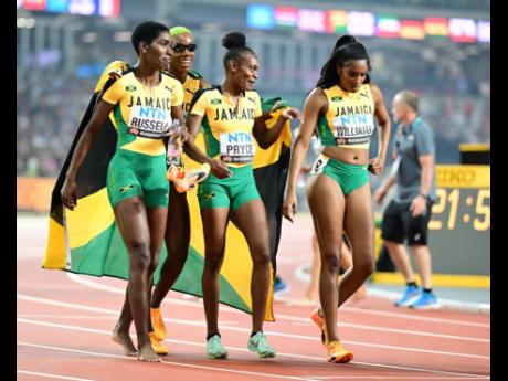 Gladstone Taylor / Multimedia Photo Editor
Women’s 4x400m silver medalists (from left) Janieve Russell, Candice McLeod, Nickisha Pryce and Stacey-Ann Williams.