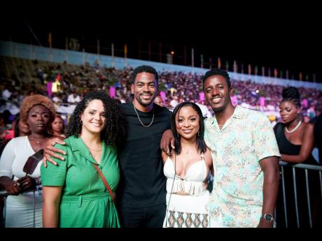 Romain Virgo (right) and his wife Elizabeth took a minute from dancing with friends Ruth (left) and Niko Browne to smile for the camera.
