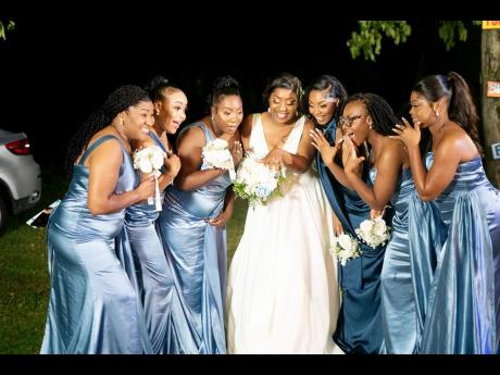 The bridal party and the radiant bride (from left): Dr Kerry Ann Skyers Harrison, Krystal Honeyghan, Lemeisha Brown, Betrece Braham, Tekelia Powell, and Glacian Pinnock. 