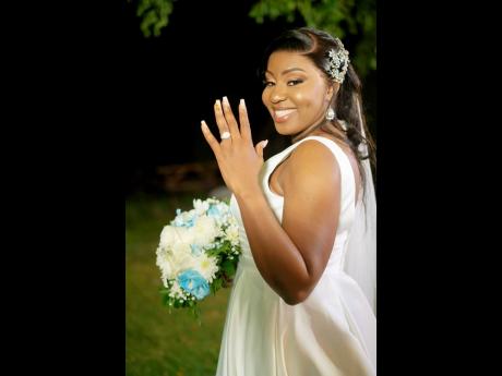 Blushing bride, Jemeta Whyte, is all smiles as she shows off her diamond ring.