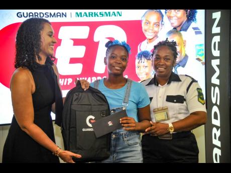 From left: Roxan Wais-Shirley, general manager – sales, marketing and customer service at the Guardsman Group, presents Mickayla Surfe with a scholarship as her mother, Deaian Nelson, looks on.