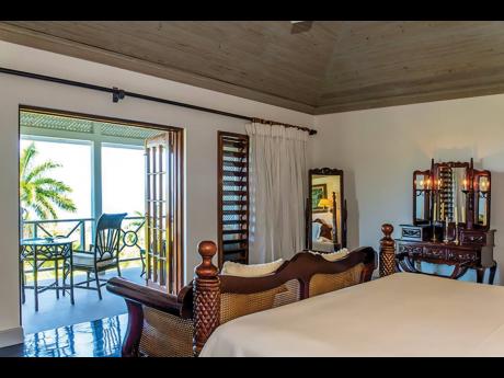 Timber tray ceiling bedroom, with its own private garden patio, takes in the prevailing sea breeze.
