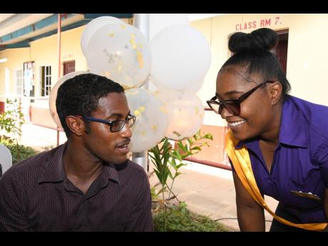Ricardo Dystant, chief of digital transformation and special projects, JN Bank, in conversation with Kerian Richards, a student in the Portmore Community College Accounting/Finance and Management programme, during the institution’s Accounting/Finance and