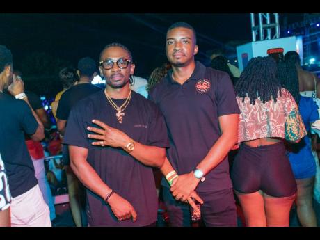 Reggae-dancehall singer, Christopher Martin (left), caught up with Dragon Assistant Brand Manager, Arnaldo Martin, at Streetz Festival.