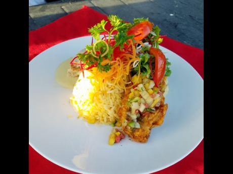 Presentation and great taste are important components of this pan-seared chicken breast, served with saffron rice and fresh vegetables.