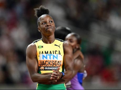 Jamaica’s Shericka Jackson celebrates a World Athletics Championships title and record, 21.41 seconds inside the National Athletics Centre in Budapest, Hungary, last month.