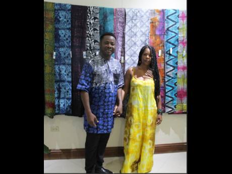 Nigerian Cultural Diplomat Alao Luqman Omotayo and one of his former students, Simone Gordon, at the opening of his batik fabric solo exhibition on Monday, August 28 inside The University of the West Indies Regional Headquarters, along Mona Road in St Andr