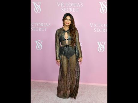 Priyanka Chopra Jonas turned heads on the pink carpet in a sheer Giambattista Valli gown.