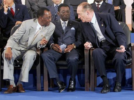 In this 2005 photo Chad President Idriss Deby, left, Equatorial Guinea President Teodoro Obiang Nguema Mbasogo, centre, and French President Jacques Chirac, right, have a chat prior to the opening of the 23rd Africa-France summit in Bamako, Mali.