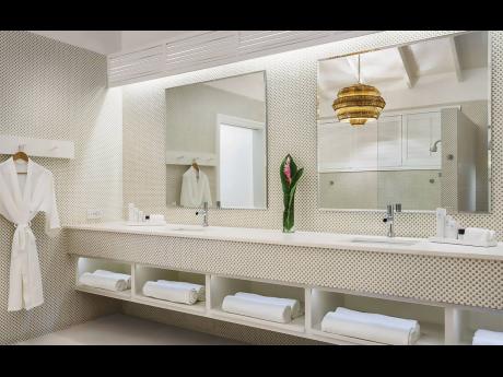 A double basin vanity in a spa-like bathroom.
