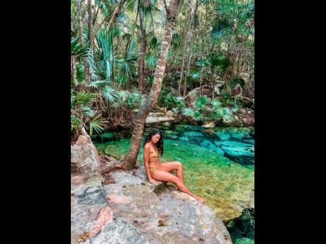Swimming in the Cenote Azul, Playa Del Carmen, in Mexico, is one of Pouyat’s best travel experiences to date.