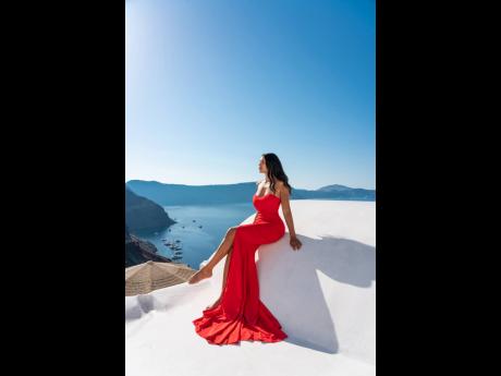Much like the goddesses of that country, the globetrotter makes a stunning statement in Oia Santorini, Greece.