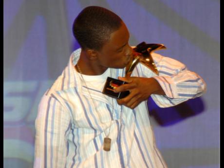 Christopher Martin kisses his trophy after winning the 2005 'Digicel Rising Stars' competition.  