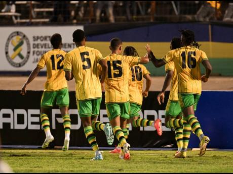 
Reggae Boyz celebrate scoring the lone goal of their Concacaf Nations League A encounter against Honduras at the National Stadium on Friday night.