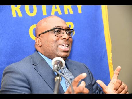 Leighton Johnson, president of the Jamaica Teachers’ Association, speaks on the topic ‘Teacher Migration and its Impact on the School System’ at the Rotary Club of New Kingston’s general meeting at Liguanea Club, New Kingston, on Friday. 