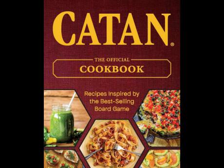 This cover image released by Ulysses Press shows ‘Catan: The Official Cookbook’. It includes 77 recipes inspired by the multiplayer game phenomenon, dishes like forest dweller’s dip, tavern ale pie and fireside banana boats. 