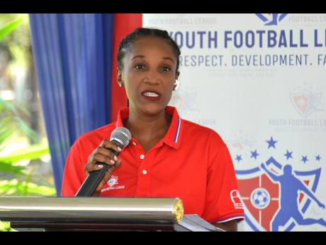 Free Your Image Consultancy Group Managing Director Paula Pinnock speaks during the launch of the sophomore year of the Youth Football League at Funland Jamaica inside Hope Gardens yesterday. 