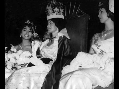 Marguerite LeWars (centre), Miss Cherry Heering, winner of the Miss Jamaica 1961 beauty title from a field of 12 contestants at the Myrtle Bank Hotel. She is flanked by Chriss Leon (left), Miss Special Amber, who was placed second and Erica Sturrock, Miss 