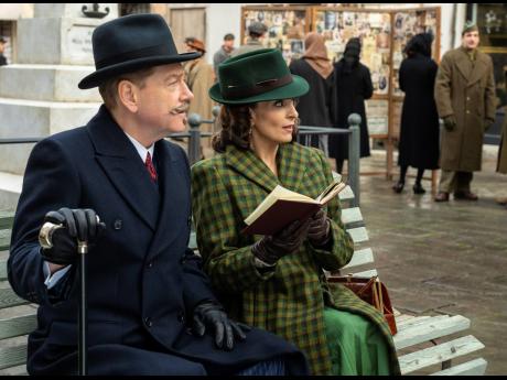Kenneth Branagh as Hercule Poirot (left), and and Tina Fey as Ariadne Oliver in a scene from ‘A Haunting in Venice’.