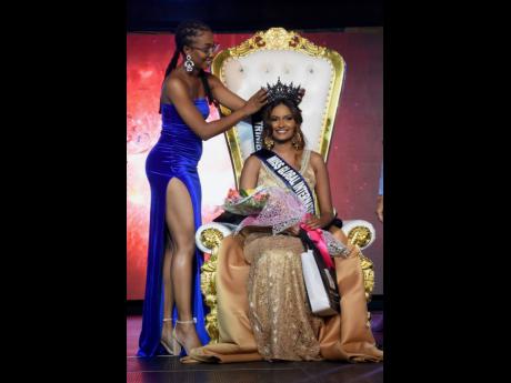 Miss Global Jamaica 2019 Brithney Clarke (left) crowns Trinidad and Tobago’s Christin Coeppicus.