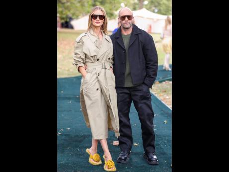 Model Rosie Huntington-Whiteley (left) attended the fashion show with her fiancé, Jason Statham.