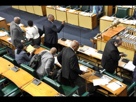 Rudolph Brown/Photographer
Opposition Leader Mark Golding and his members walk out of Parliament after House Speaker Marisa Dalrymple Philibert addressed members of parliament.