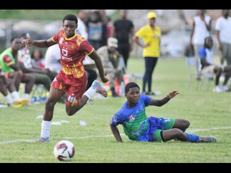 Wolmer’s Boys’ School’s Demetri Jackson skips past the challenge of Vauxhall High School’s Kyle Chen during their ISSA Manning Cup encounter at the Mico University yesterday.Wolmer’s Boys’ School’s Demetri Jackson skips past the challenge of 
