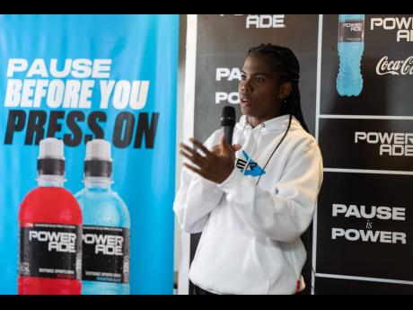Reggae Girlz captain Khadija Shaw speaks during her unveiling as a Powerade ambassador during a ceremony at the ROK Hotel in Kingston, yesterday.