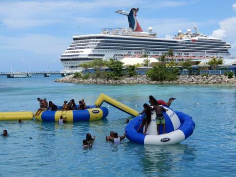 Tourists enjoy themselves in sea by Island Village, close to the Ocho Rios Pier in St Ann.
