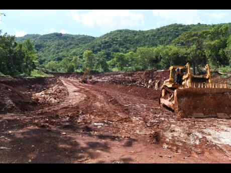 This file photo shows an area being cleared for the construction of a roadway for Bauxite mining in Harmons, Manchester.
