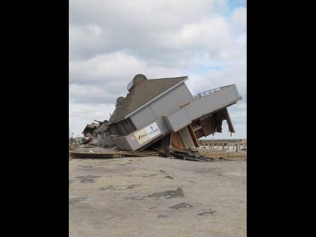 A beach club destroyed by Superstorm Sandy on the sea wall on November 15, 2022, in Sea Bright. New Jersey, like places around the world, is setting ambitious goals to deal with climate change, but it is wrestling with how much to actually require of busin