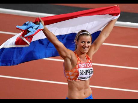 Netherlands’ Dafne Schippers celebrates after winning the Women’s 200 meters final at the World Athletics Championships in London on Friday August 11, 2017. 