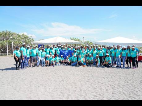 Volunteers pause for a quick photo following the ICC beach clean-up hosted by the EU in collaboration with JET.