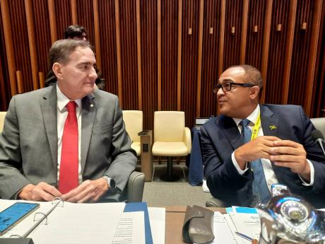 Health and Wellness minister Dr Christopher Tufton (right) shares in a discussion with Dr Jarbas Barbosa Da Silva, director, Pan-American Sanitary Bureau, at the 60th Directing Council of the Pan American Health Organization, at its headquarters in Washing