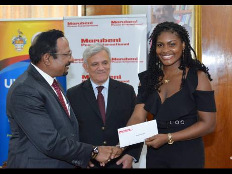 Mohamed Majeed (left), managing director, Caribbean operation, Marubeni Power International, presented a scholarship cheque to Rochelle Stephen (right). He was joined by Damian Obiglio, senior vice president of Marubeni Power International.
