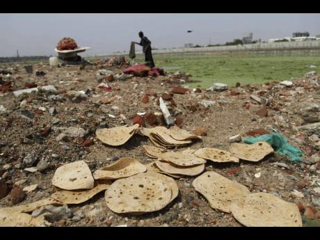 In this June 2013 photo, discarded rotis are seen strewn along Sabarmati River in Ahmedabad, India. 