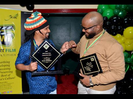 Miller bumps fists with friend, collaborator and fellow competitor, George Malcolm Walker. Walker took home the second-place prize as well as Best Sound Effects/Score, Best Comedy and Best Directing.  