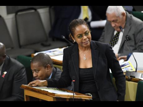 Marlene Malahoo Forte, minister of legal and constitutional affairs, addressing a sitting of the House of Representatives at Gordon House on Tuesday,