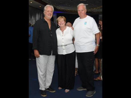 From left: Lee Issa, chairman of Couples Resorts, with Virginia Johnson and her husband, John, who have made multiple visits to the island. 