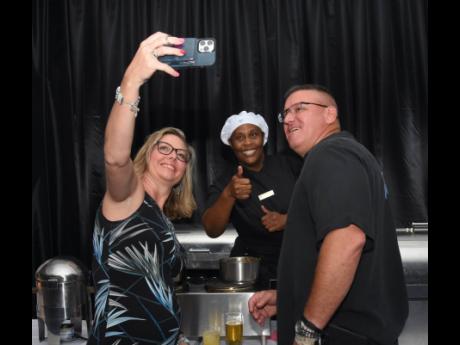 From left: Dirinda Terry takes a selfie with Kedean Clarke, sous chef, and Stephen Terry.