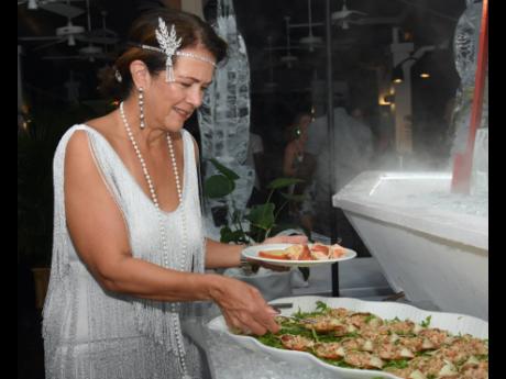 Suzanne Mercurio helps herself to a serving from the delectable seafood station. 