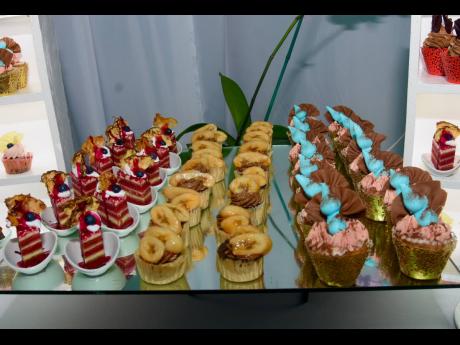 Cupcakes of all shapes, sizes, flavours and playful toppings, on display for guests to enjoy. 