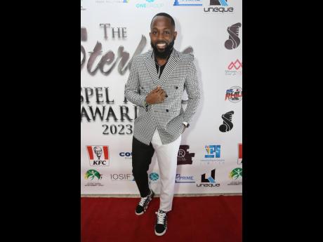 Chevaughn Walker of H.U.M.B.L.E makes a statement on the red carpet at the Sterling Gospel Music Awards, as he represents the black-and-white theme.