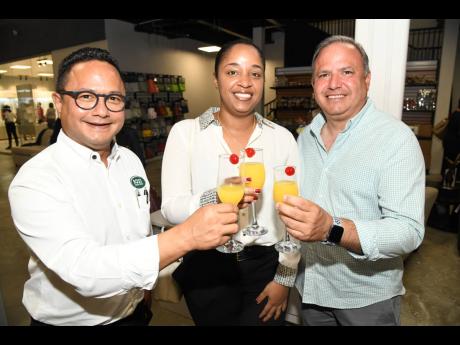 Raising a toast to a successful opening are (from left) Omar Azan, chief executive officer, Boss Furniture; Lindsay Richards, assistant vice president, Citibank; and Dominic Azan, director, design and production, Boss Furniture. 