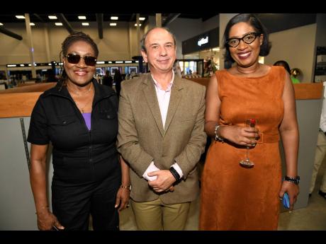 Maxine Anderson (left), former Caribbean director, human resources, and Unicomer executives; Manuel Pereira (centre), vice president of IT; and Carri Stewart, director, human capital, pause for a quick photo. 
