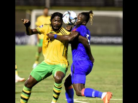 
Jamaica’s Shamar Nicholson (left) gets into a battle with Haiti’s Djimy Alexis during their Concacaf Nations League Group A football match at the National Stadium on September 12. 