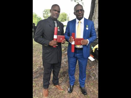 Ruel Grant (left) and Keith Nugent, who were awarded Badges of Honour for Gallantry on Monday.