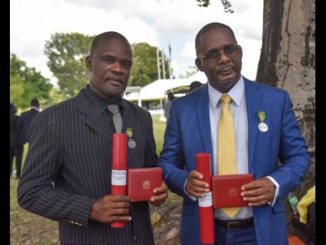 Ruel Grant (left) and Keith Nugent, who were awarded Badges of Honour for Gallantry on Monday.