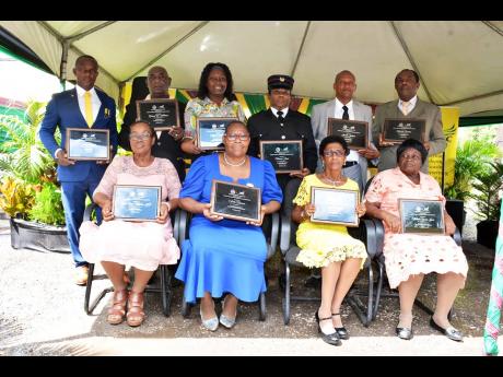 The 10 Hanover 2023 National Heroes’ Day awardees pose for the cameras following the presentation which took place on Sunday in the Sir Alexander Bustamante Square in Lucea.